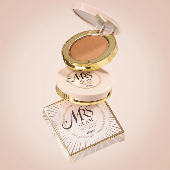 Compact powder with gold lid and 'Mrs Glam' branding on a light pink background