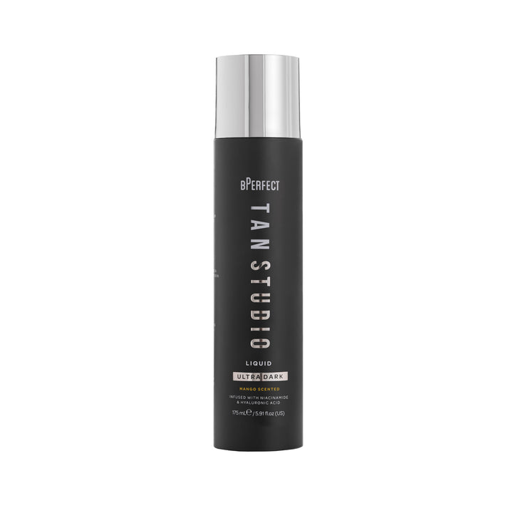 Black bottle with silver cap labeled 'Tan Studio' on a white background
