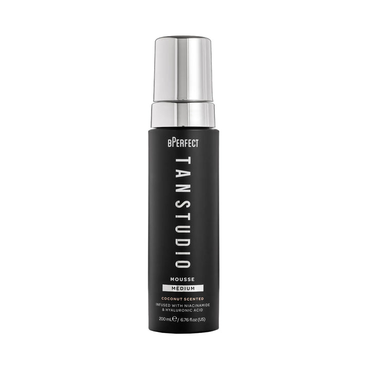 Black bottle of BPerfect Tan Studio Mousse with silver cap on a white background